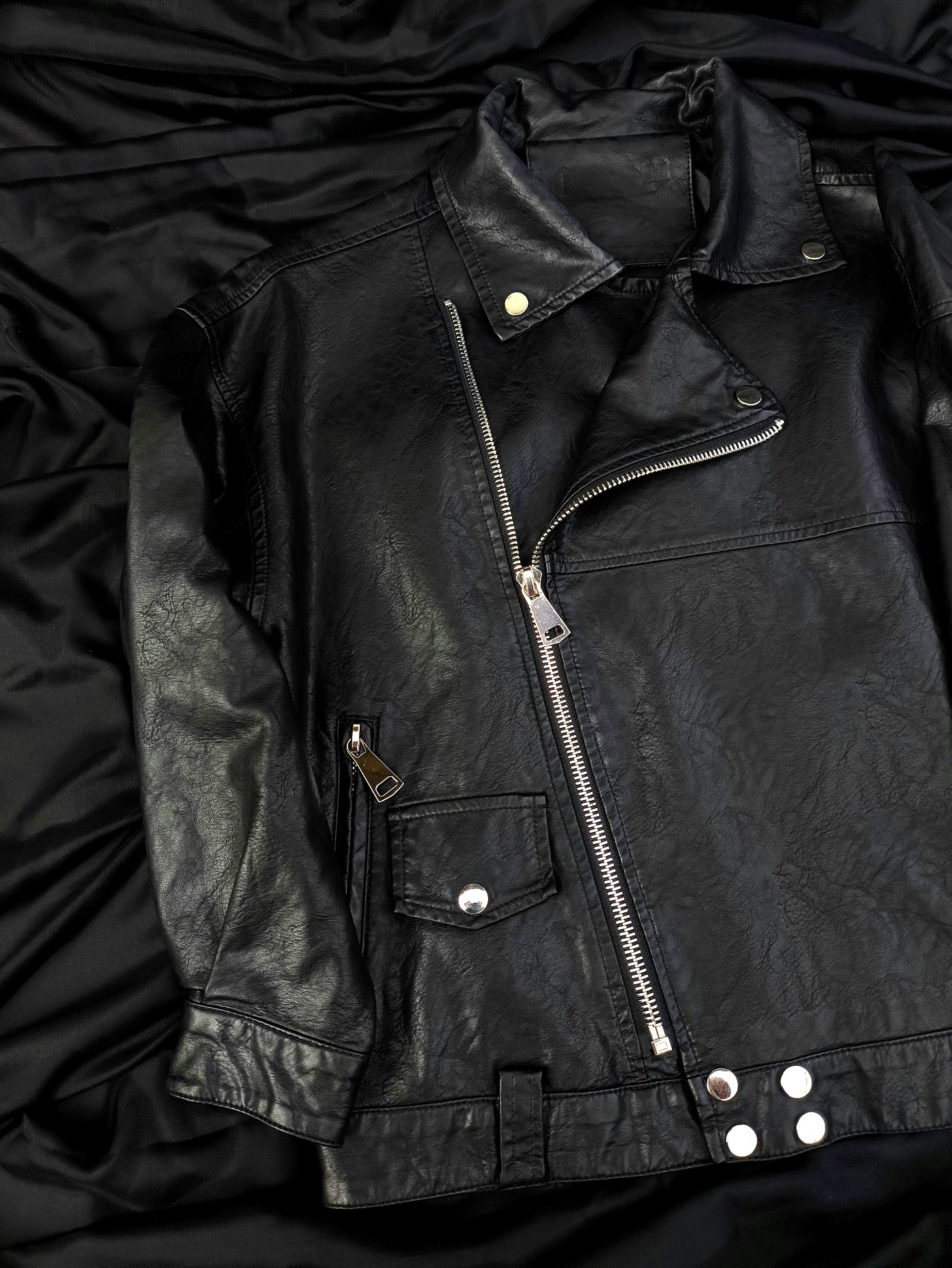 Cleaned leather jacket showing intact stitching, hardware and finish